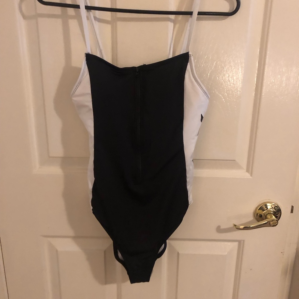 NWOT one piece Hurley swimsuit. Size medium, black & white. New without tags
